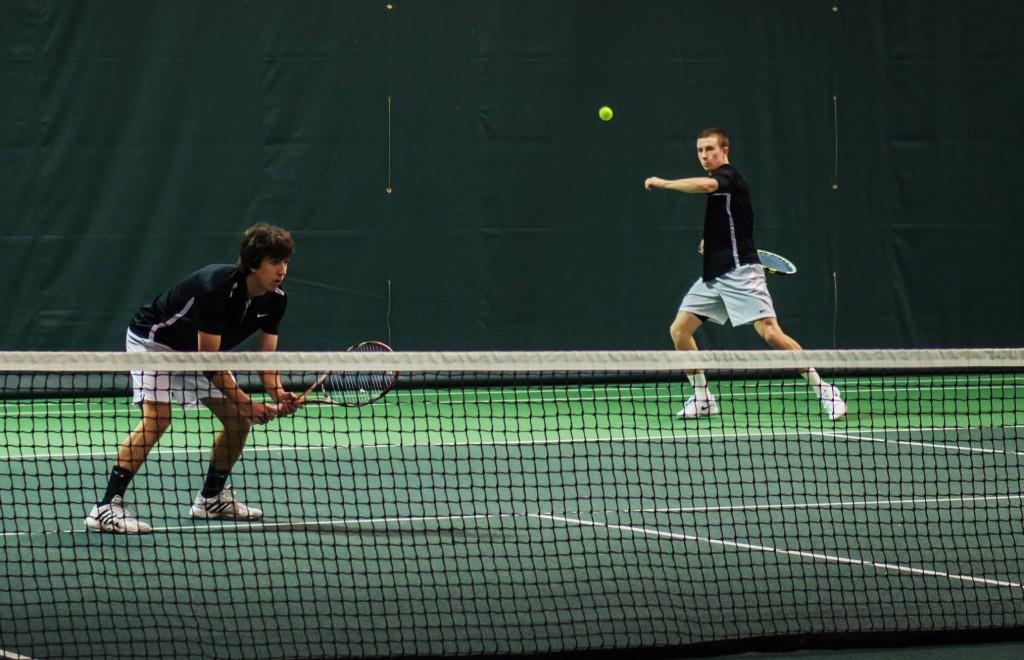 Ben+Charney+%E2%80%9915+and+Rob+Storrick+%E2%80%9915+play+doubles+at+the+tourney+against+Wartburg+on+Sunday+morning.+Photograph+by+John+Brady.