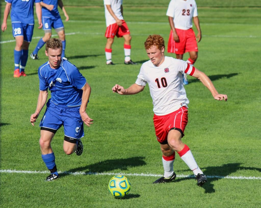 Michael+Hurley+%E2%80%9916+dribbles++against+the+University+of+Dubuque+on+Wednesday%2C+Sept.+3.+Photo+by+Sarah+Trop.+