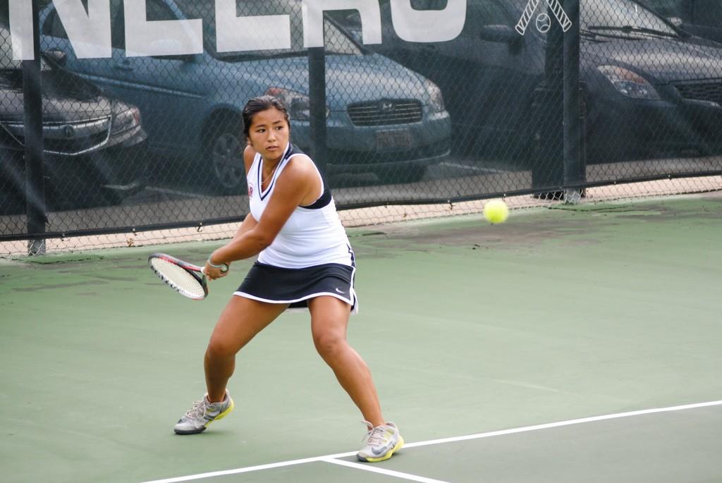 Shirlene+Luk+%E2%80%9915+hits+a+forehand+against+Augustana+College+on+Thursday%2C+Aug.+28.+Photo+by+Connie+Lee
