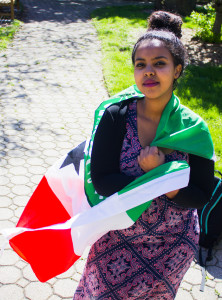 Deqa Aden is fundraising for drought alleviation efforts in Somaliland, whose flag she is pictured holding. Photo by Misha Gelnarova.