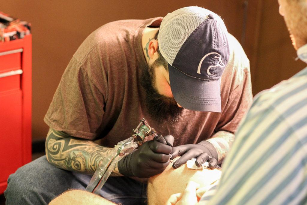 Photo By Jackson Schulte
Marchesi gets tattooed by Reed