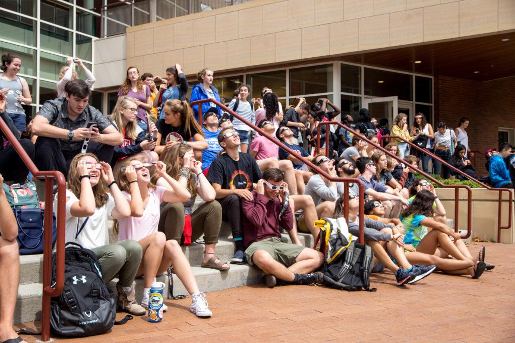 Students view the 2017 solar eclipse outside the JRC. Nobodys looking at the sun without their special eclipse glasses.