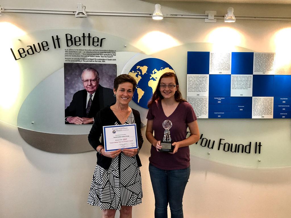 Reverend Deanna Shorb, dean of religious life, and Nina Galanter 18 accept the Leave It Better Than You Found It Award for their work involving the community meal. Photo contributed.