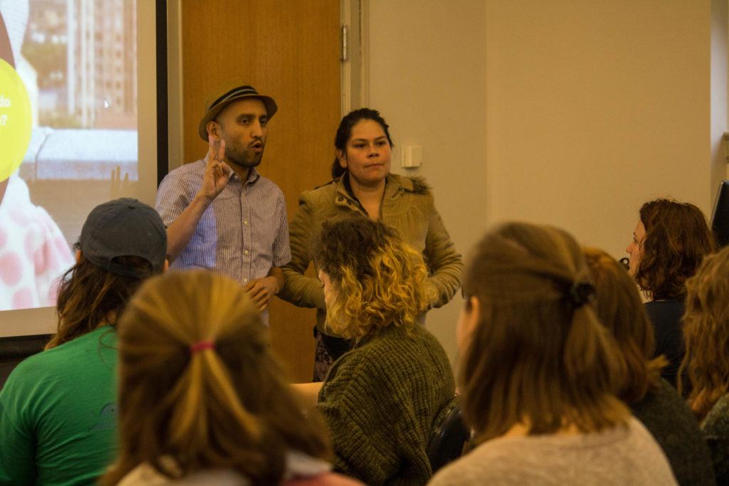Carol Rojas (right) with her translator (left) speaks to students interested in grassroots organizing over lunch. Photo by Charun Upara 