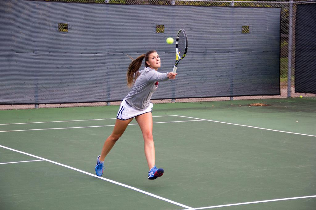 Shannon+Hautzinger+18+chases+a+ball+down+at+tennis+practice.+Next+year%2C+the+College+will+get+new+home+tennis+courts.+Photo+by+Reina+Shahi.