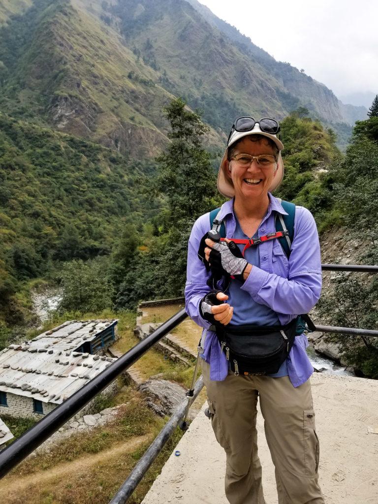Librarian+Chris+Gaunt+appears+smiling%2C+decked+out+in+trekking+gear+for+her+hike+through+the+Himalayas.+Contributed+photo.