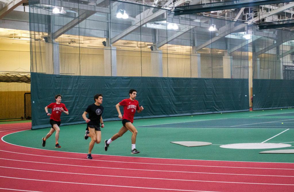 John Osler ’20, Matt Lieberman ’21 and Jackson Schulte ’20 prepare for this weekends indoor track conference in Ripon. Photo by Elena Copell. 