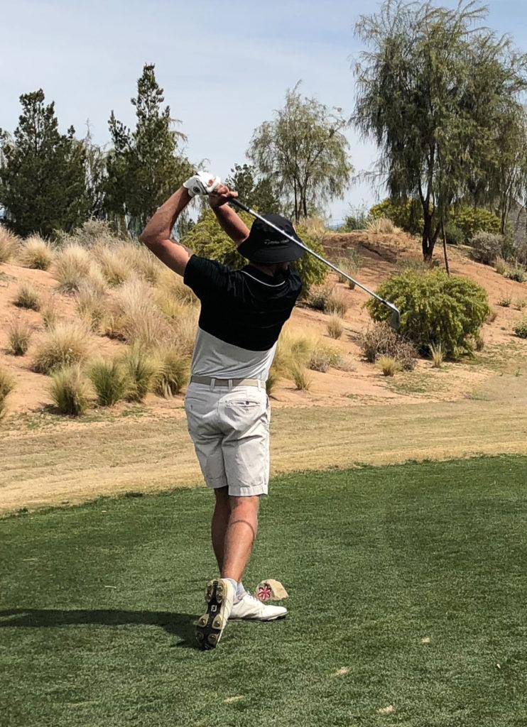 Evan Bunis 18 following through on a shot taken during the golf teams spring break trip to Arizona. Contributed photo.