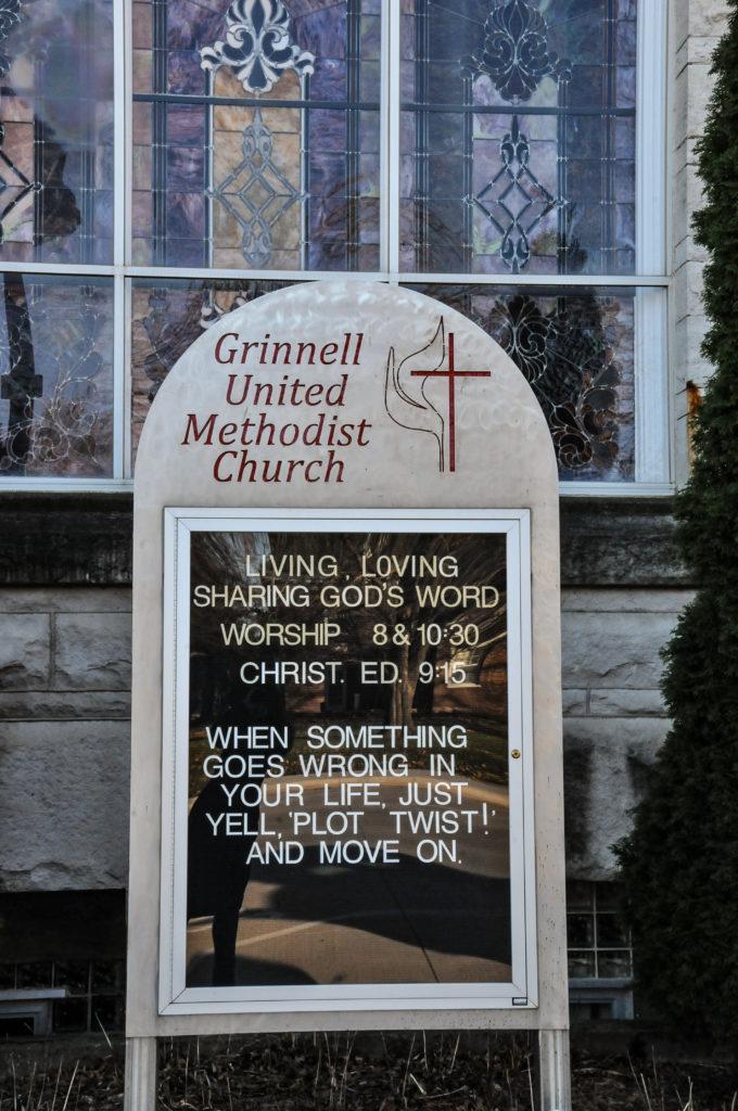 Several staff members at the Grinnell United Methodist Church work together to create the rotating messages for this marquee, located on 5th Street. Photo by Sarina Lincoln.