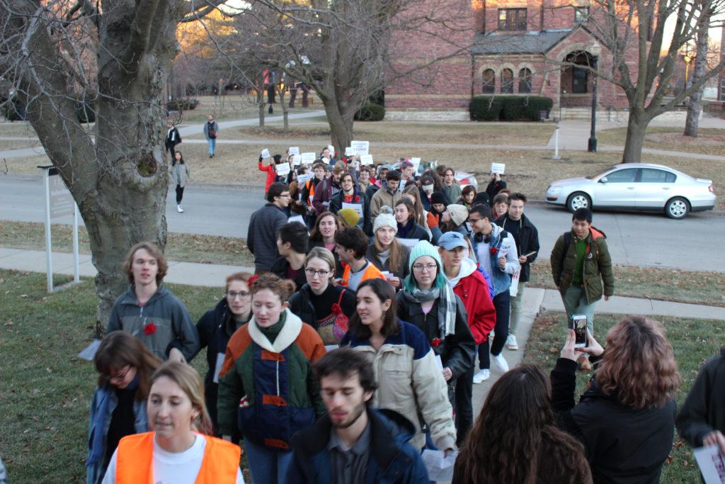 Student protesters gather outside Mears Cottage awaiting orders to march to Nollen House. Photo by Jackson Schulte.