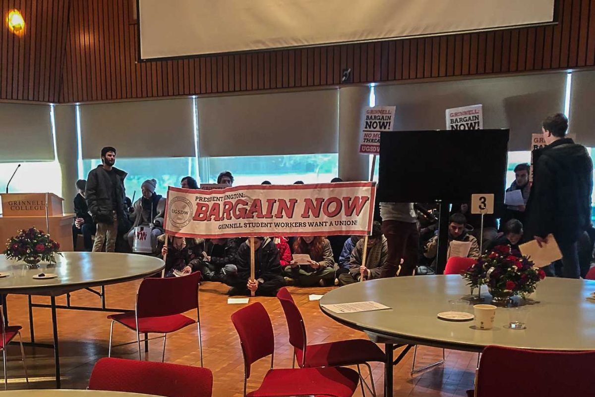 On Feb. 8, 2019, Union of Grinnell Student Dining Workers members protested at a Board of Trustees event, pushing for the College to continue to negotiate with students. 