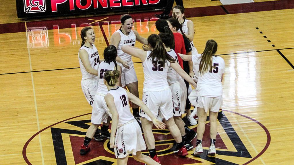Womens+basketball+celebrate+victory+over+Monmouth+College+on+Feb.+2.