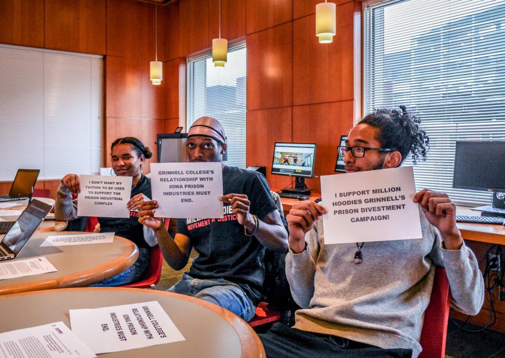 CErra+Houston+21%2C+Jelani+McCray+21+and+Malcolm+Davis+21+tabling+for+Million+Hoodies+prison+divestment+action.+Photo+by+Caelin+Bryant.