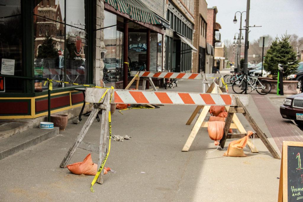 Parts of the sidewalk in front of popular businesses Saints Rest and Bikes To You have been blocked off after a large piece of stone fell from the facade of Saints Rest. The incident prompted a greater investigation into the well-being of the facades. Photo by Shabana Gupta.