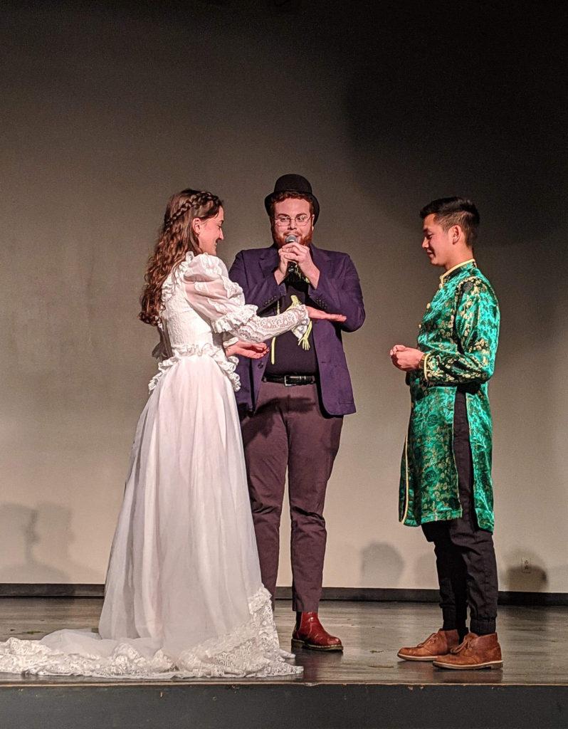 Nolan Boggess ’19 officiates a wedding between Lucie Duffy ’19 and Steven Duong ’19 for the finale of Tithead 2019. Contributed photo.