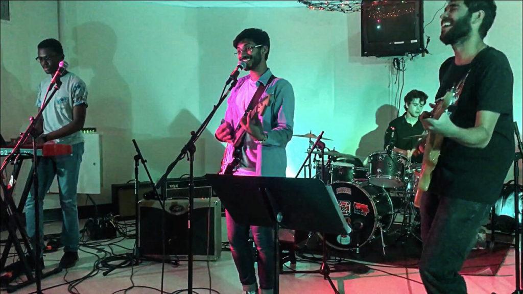 Student band Sorry Were Late, made up of Saketan Anand ’21, Charun Upara ’21, Declan OReilly ’21 and Rexford Essilfie ’22, opens for a concert held in the Gardner Lounge in the spring of 2019. by Saketan Anand.