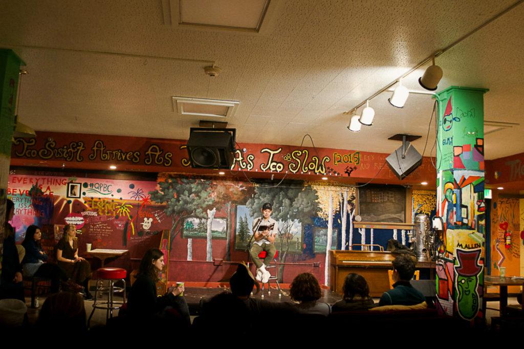 A student performs at an open mic at Bobs Underground. Photo by Elena Copell.