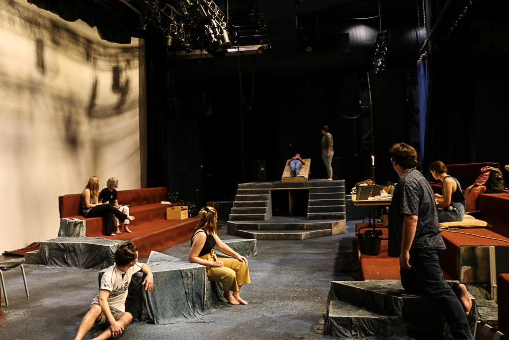 Cast members of The Burial at Thebes, directed by Ellen Mease, rehearse in Roberts Theater. Photo by Isabel Torrence.