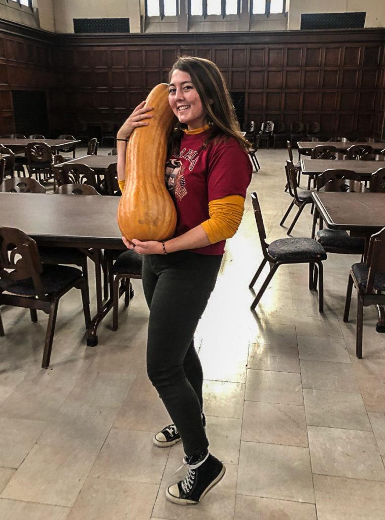 Tess Kerkhof ’21, holds one of the gourds that will be served at the local foods dinner on Sunday, Nov. 22. Contributed by Tess Kerkhof. 
