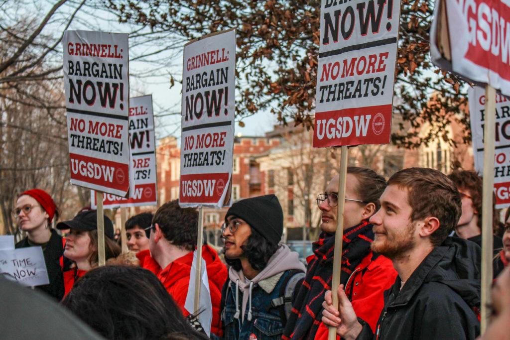 Students rallied in support of UGSDW outside of Nollen House in December 2019. Speakers who addressed the crowd argued there is a disconnect between Grinnell’s reputation for social justice and the administration’s delay in partial unionization. Photo by Shabana Gupta
