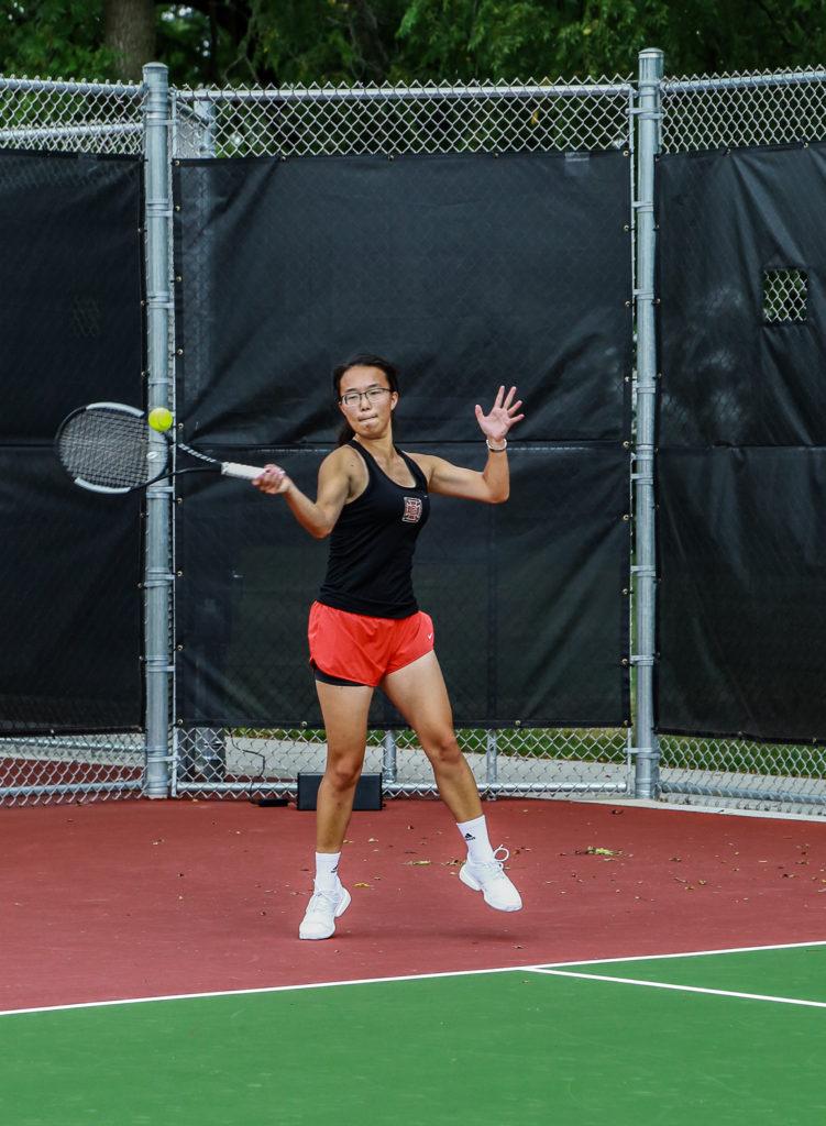 Brenda Guan ‘20 drives a ball back at her opponent during a match.