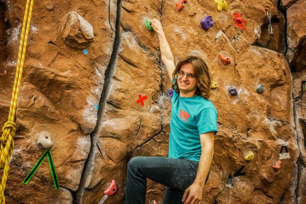 Duncan Ward ‘20 hangs out on the climbing wall in the Bear. Photo by Alexandra Fontana.