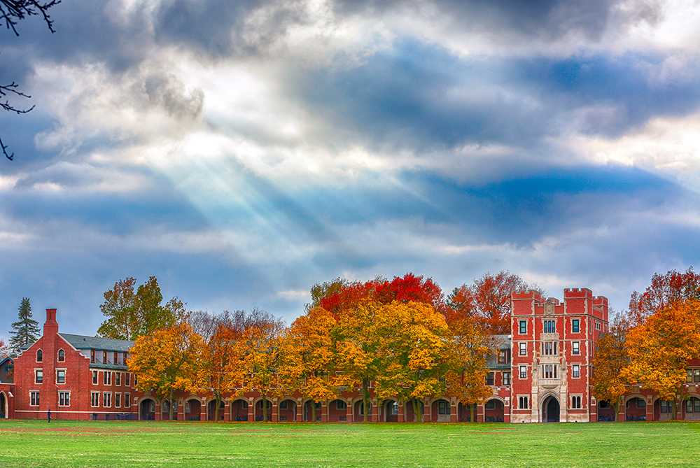 Sun breaks through the clouds over Mac Field and Gates-Rawson tower. (Photo by Justin Hayworth/Grinnell College)