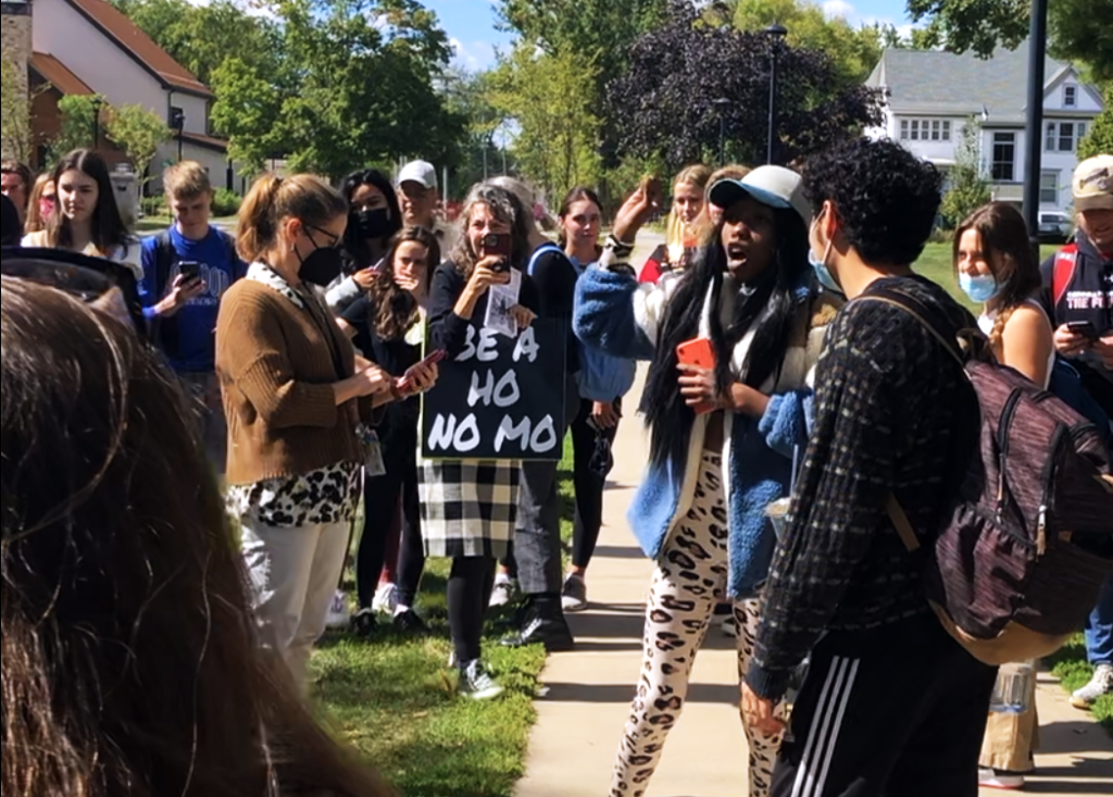 Raven McClendon `22 urges students to disperse and pay no attention to the demonstrators. Photo by Lucia Cheng.