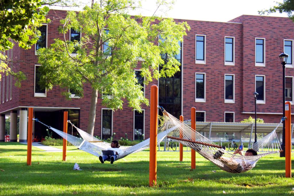 Students relaxing in hammocks outside the Joe Rosenfield Center. Photo by Natalia Ramirez Jimenez.