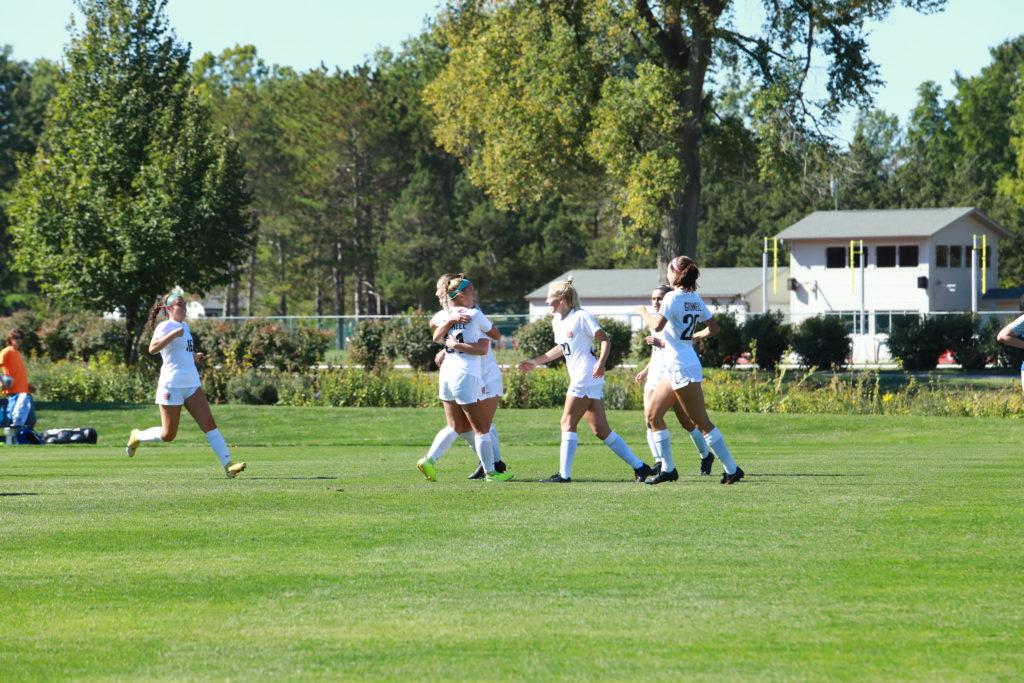 Grinnell womens soccer celebrates after scoring against Illinois College. Contributed by Ted Schultz