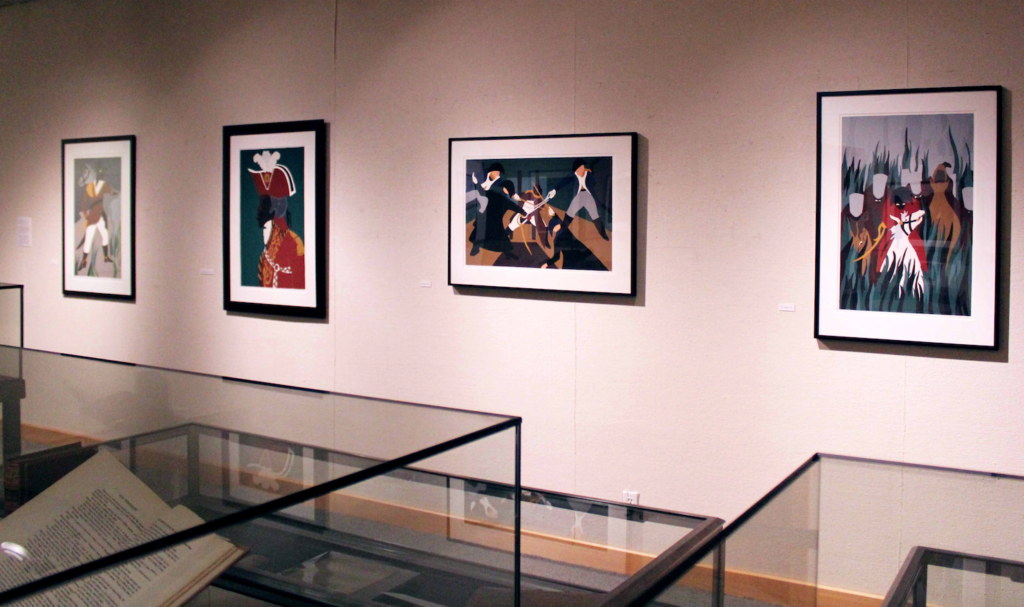 The Grinnell College Museum of Art (GCMOA) has purchased 14 of the 15 screen-prints in Jacob Lawrences series, 11 of which are currently on display in the basement of Burling Library. Photo by Maddi Shinall.