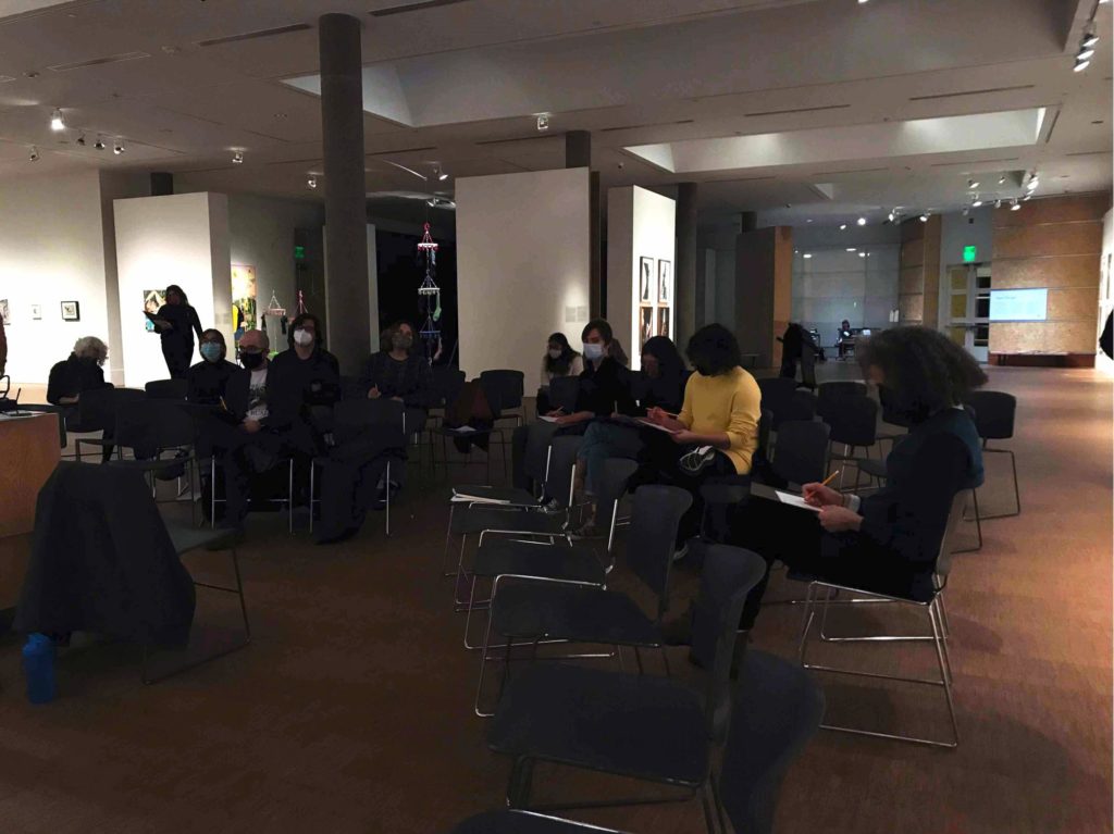After each reading, Santiago Sanchez invited participants to share thoughts, reactions and connections with or between the literature and the art. Photo by Elisa Carrasco Lanusse. 