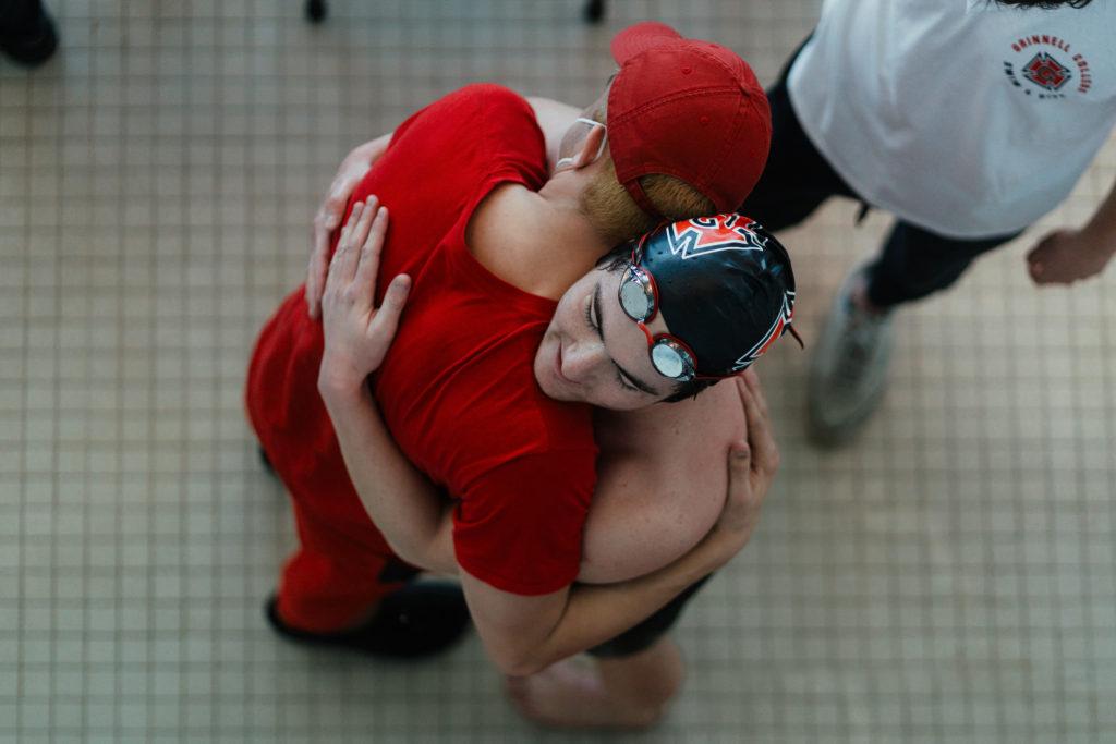 14 seniors between the mens and womens swim and dive teams competed in their final conference meet Sunday Feb. 20. Photo by Paul Hansen.