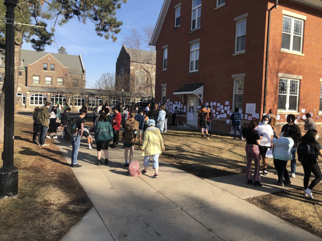Grinnell’s chapter of Cops Off Campus held a protest outside of Mears Cottage against Campus Safety’s move on
 March 16. Photo by Abraham Teuber.