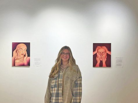 Aubrie Torhorst `23 stands between her pieces A Body Touched (left) and One Needs to be Embraced (right).