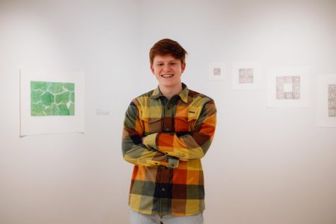 Chase Holdener `23 in front of his work in Smith Gallery.