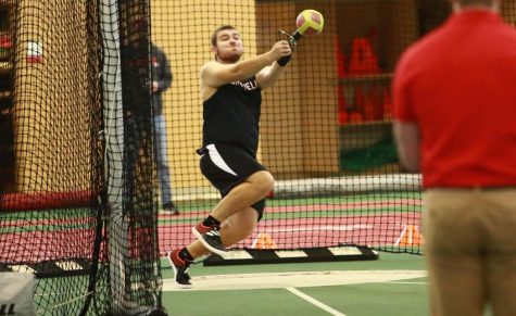 Ian Clawson `26 (above) broke the school record for the weight throw with a 54-5 1/12 toss at the Midwest Conference Indoor Track and Field Championship on Feb. 24-25. He placed third in the event.