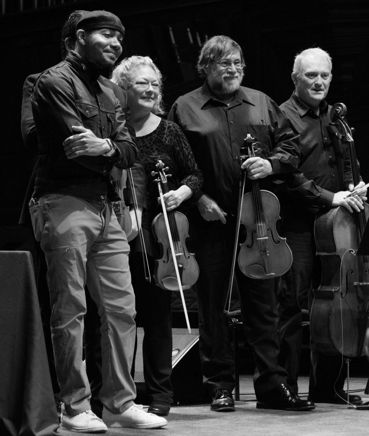 DJ Spooky with Grinnell College string instrument faculty, who accompanied him during his performance.