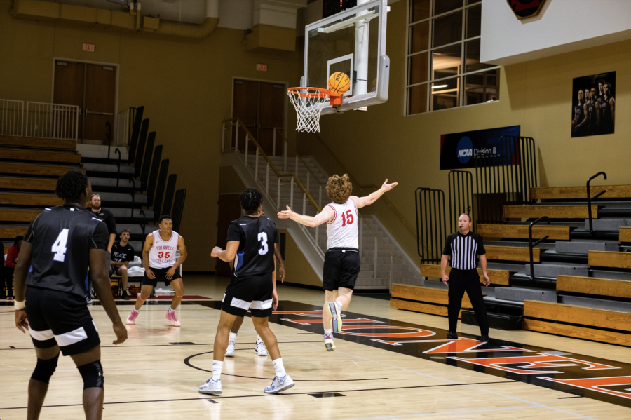 Dean Mazlish `23, number 15, goes for a layup in a scrimmage against Northern Iowa Area Community College on Oct. 26.