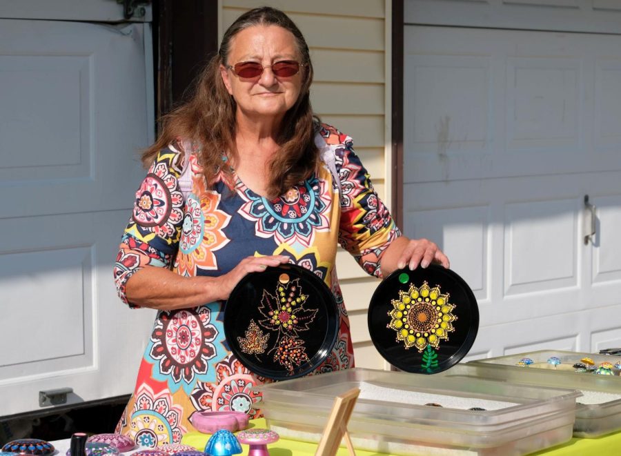 Rose Mary Pirkle decorates every one of her art pieces by hand, using a painted dot technique stylized in a mandala pattern. 
