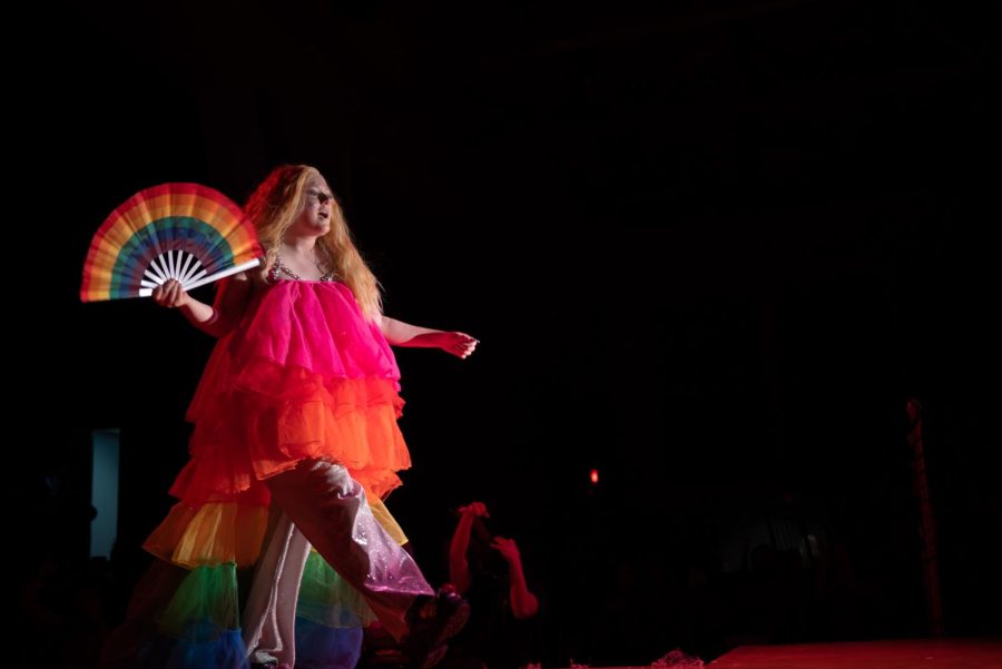 Galaxandria from the House of Glam wore a fluffy multicolored-top and waved a rainbow-colored fan.