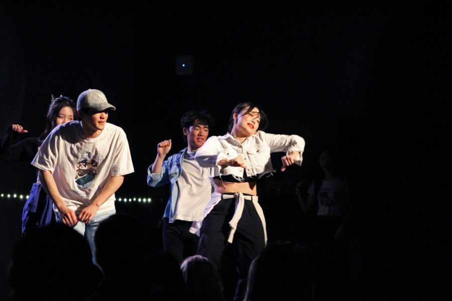 Four members of the Korean Student Association pose mid-dance move during their musical number.