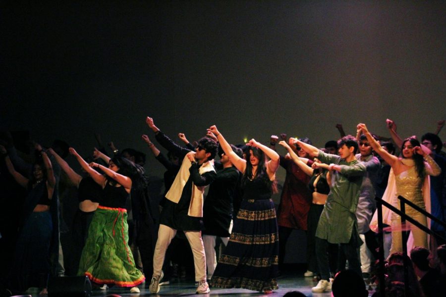 Members of the South Asian Student Organization (SASO) dance together for a group performance featuring Bollywood music.