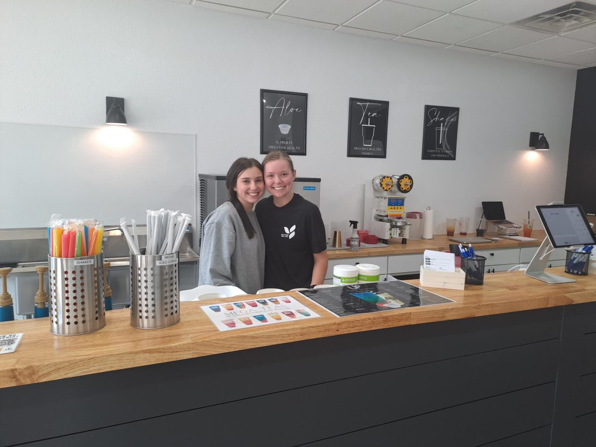 From left: Owner of Uptown Nutrition Darian Morrison and employee Jillian Miller behind the front counter of the shake and tea bar. 
