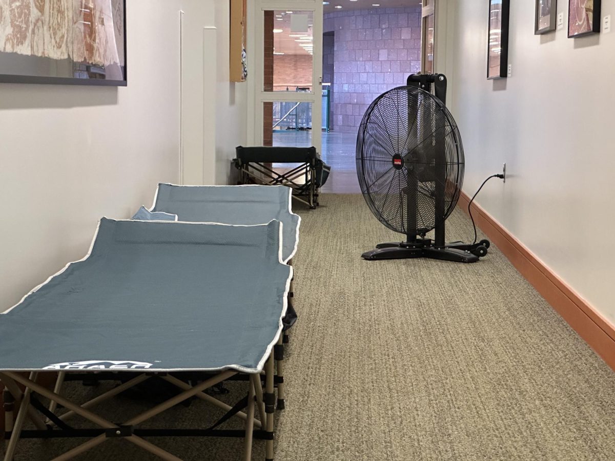 The College provided cots to help students escape the heat. 