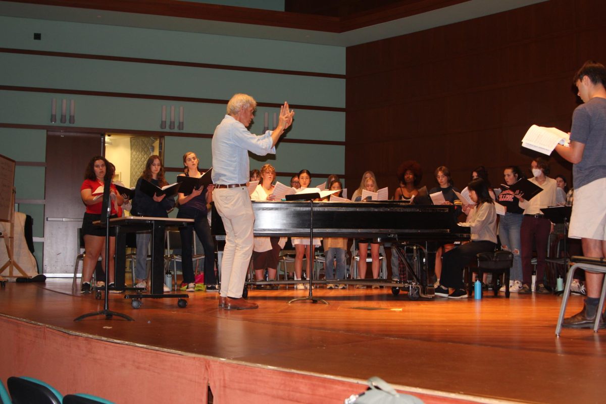 John Rommereim conducts the Grinnell Singers in rehearsal leading up to their Family Weekend Concert.