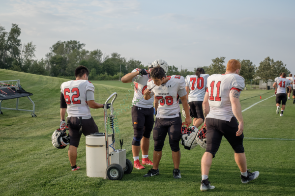 Athletes on the football team were provided with extra water during breaks and shortened practices as their coaches accounted for temperatures over 100 degrees Fahrenheit.