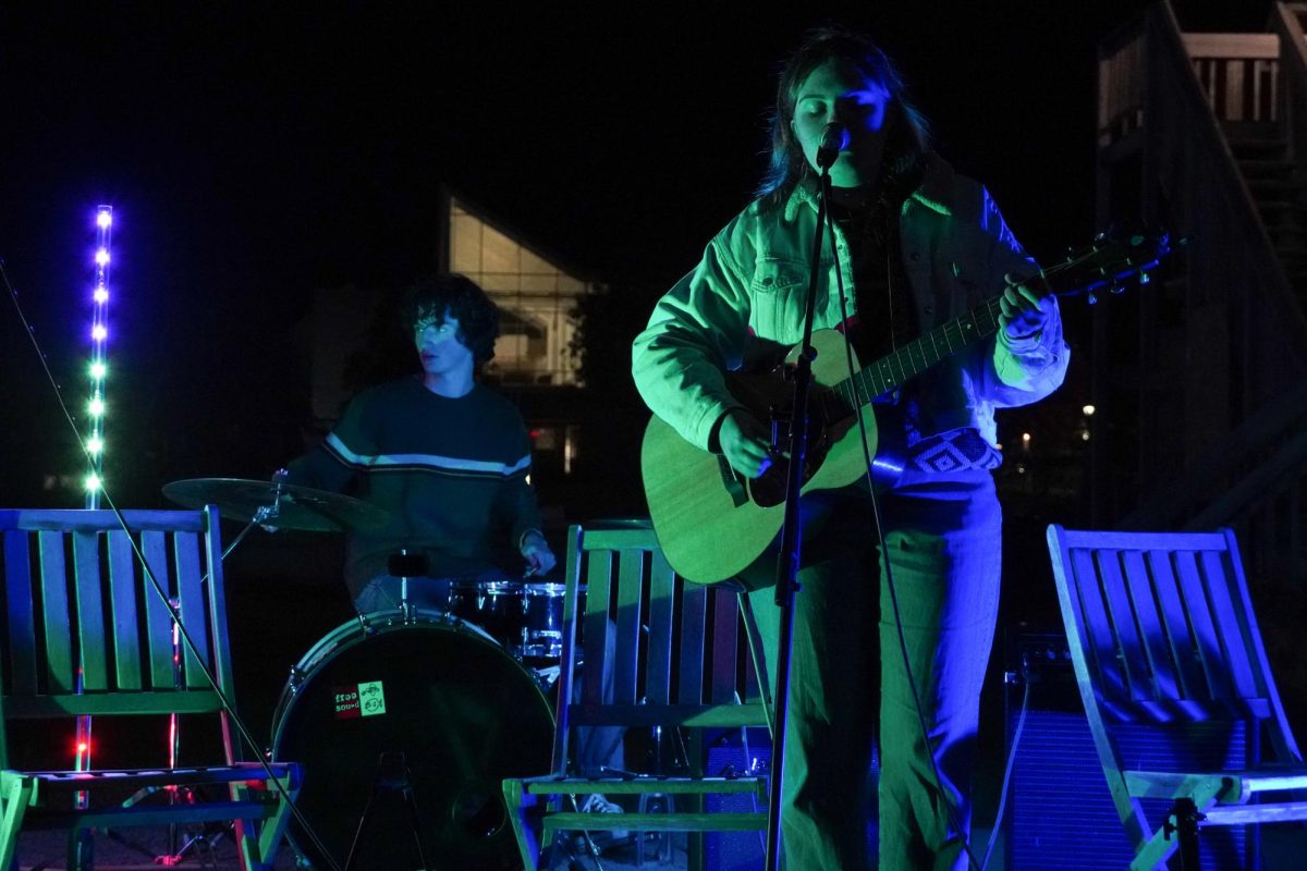 From left: Ben Curran `25 on the drums, Frannie Crego `25 playing the guitar and singing during My Best Friends set at Farmstock.