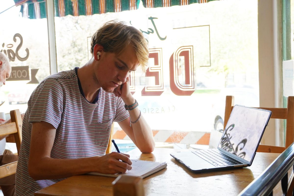 Henry Horn `26 listens to In My Life by The Beatles while on his homework grind at Saints Rest coffeehouse.