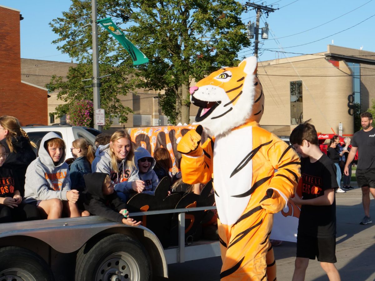 Grinnell-Newburg High Schools mascot strutting down 4th Avenue.